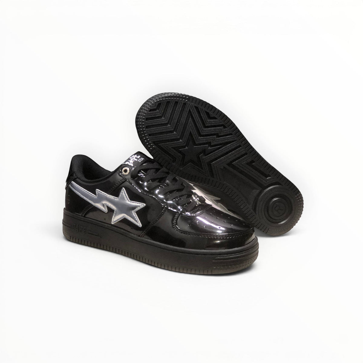 A Bathing Ape BAPE STA women's low-top sneakers in Black Patent/Silver, outsole view