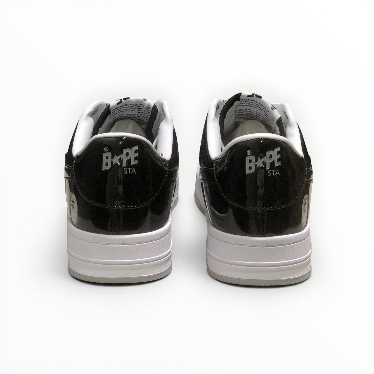 A Bathing Ape BAPE STA men's low-top sneakers in Black/Grey/White, rear heel view