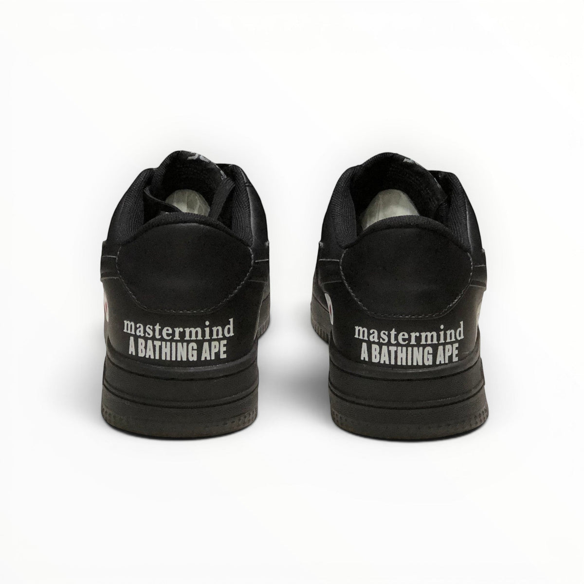 A Bathing Ape BAPE STA women's low-top sneakers in Triple Black, rear heel view
