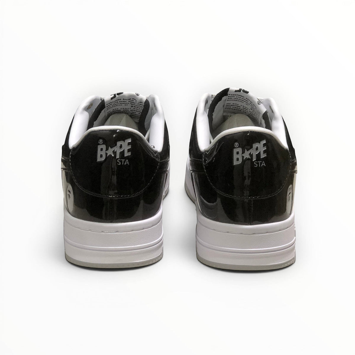 A Bathing Ape BAPE STA women's low-top sneakers in Black/Grey/White, rear heel view