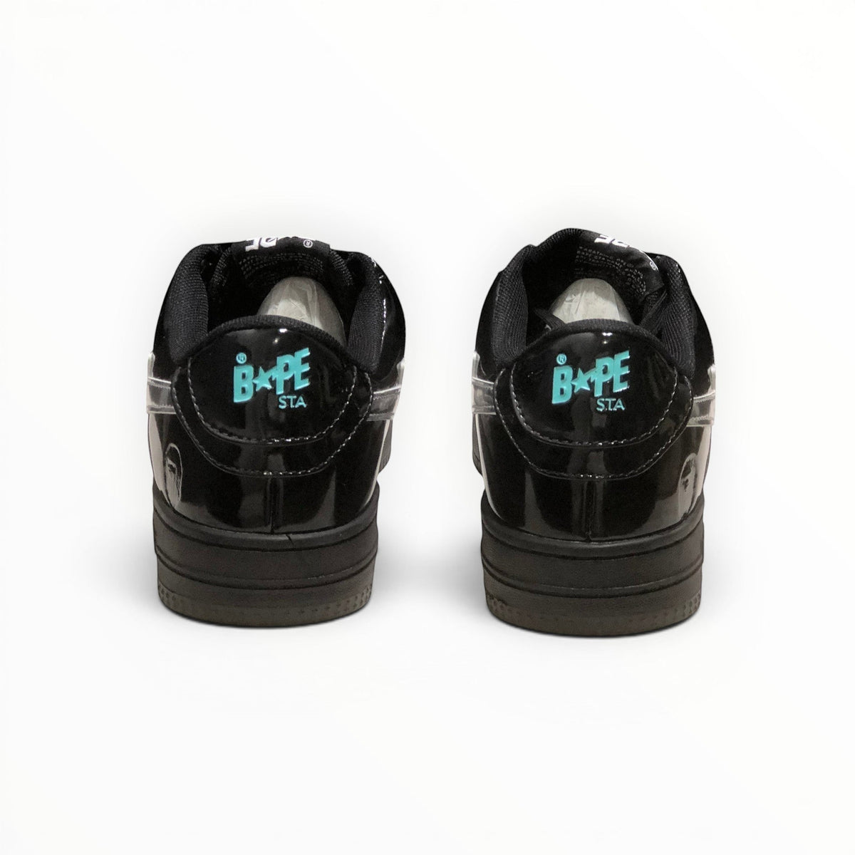 A Bathing Ape BAPE STA women's low-top sneakers in Black Patent/Silver, rear heel view