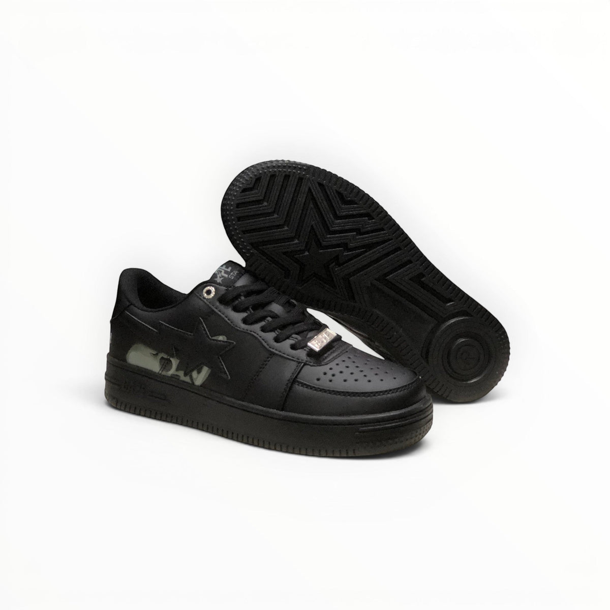 A Bathing Ape BAPE STA men's low-top sneakers in Triple Black, outsole view