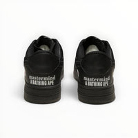 A Bathing Ape BAPE STA men's low-top sneakers in Triple Black, rear heel view