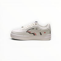 A Bathing Ape BAPE STA men's low-top sneakers in Triple White, side view