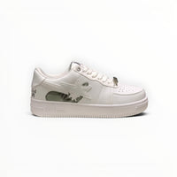 A Bathing Ape BAPE STA men's low-top sneakers in Triple White, side view