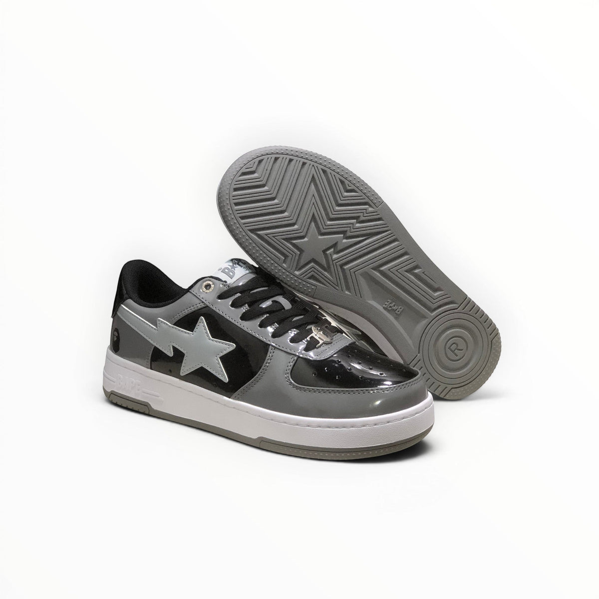 A Bathing Ape BAPE STA men's low-top sneakers in Grey/Black, outsole view