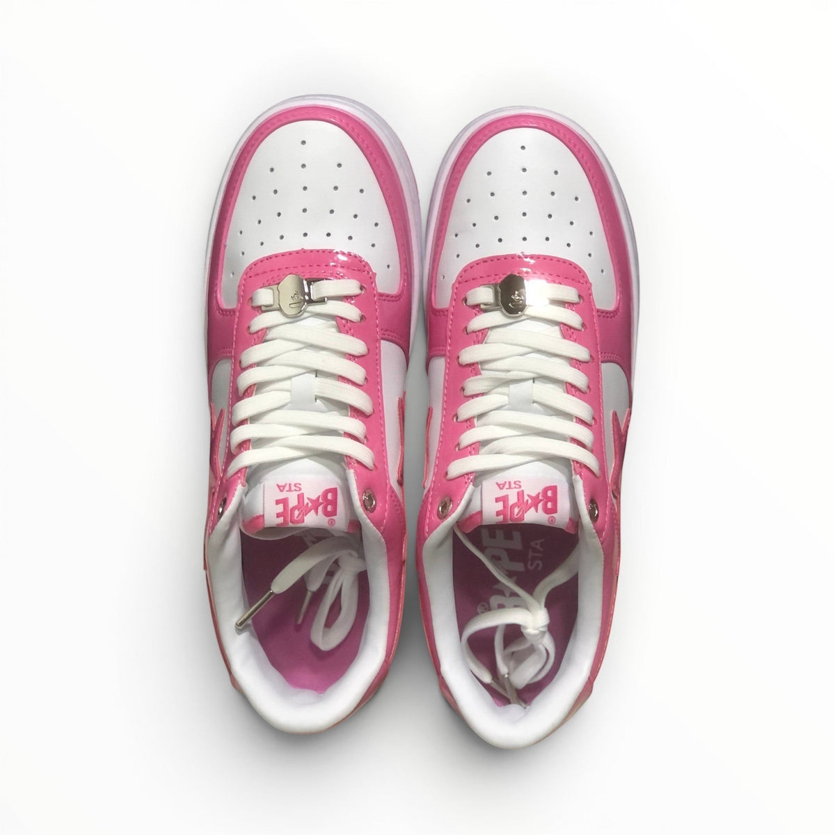 A Bathing Ape BAPE STA men's low-top sneakers in Pink/White, side view
