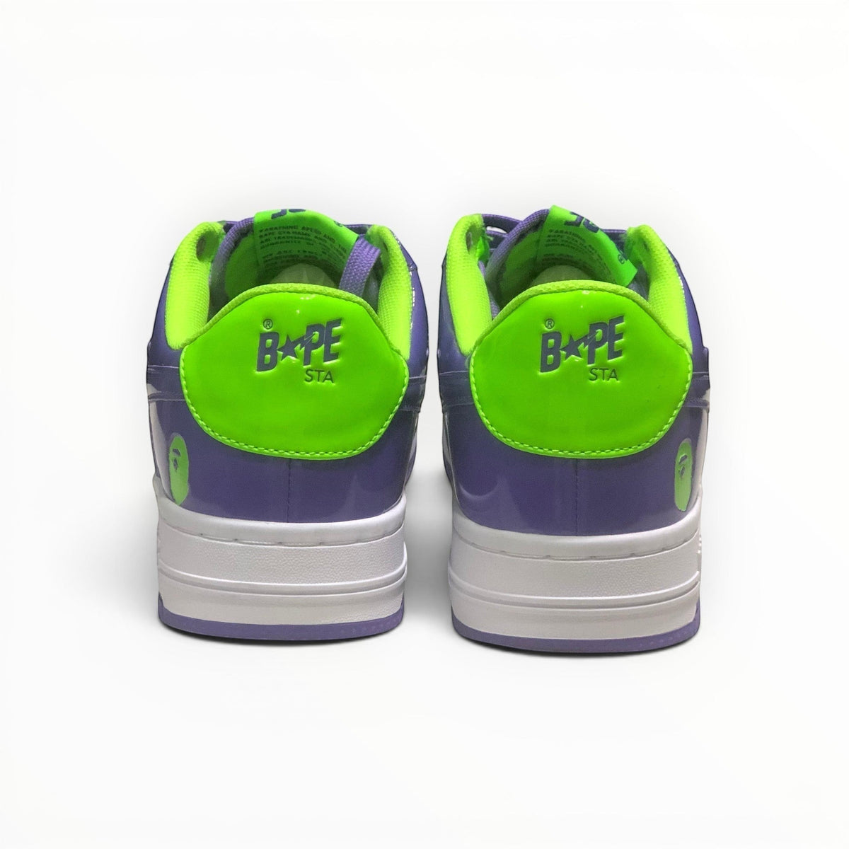A Bathing Ape BAPE STA men's low-top sneakers in Green/Purple, rear heel view