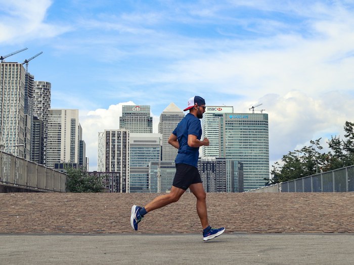 Runner beside the London skyline